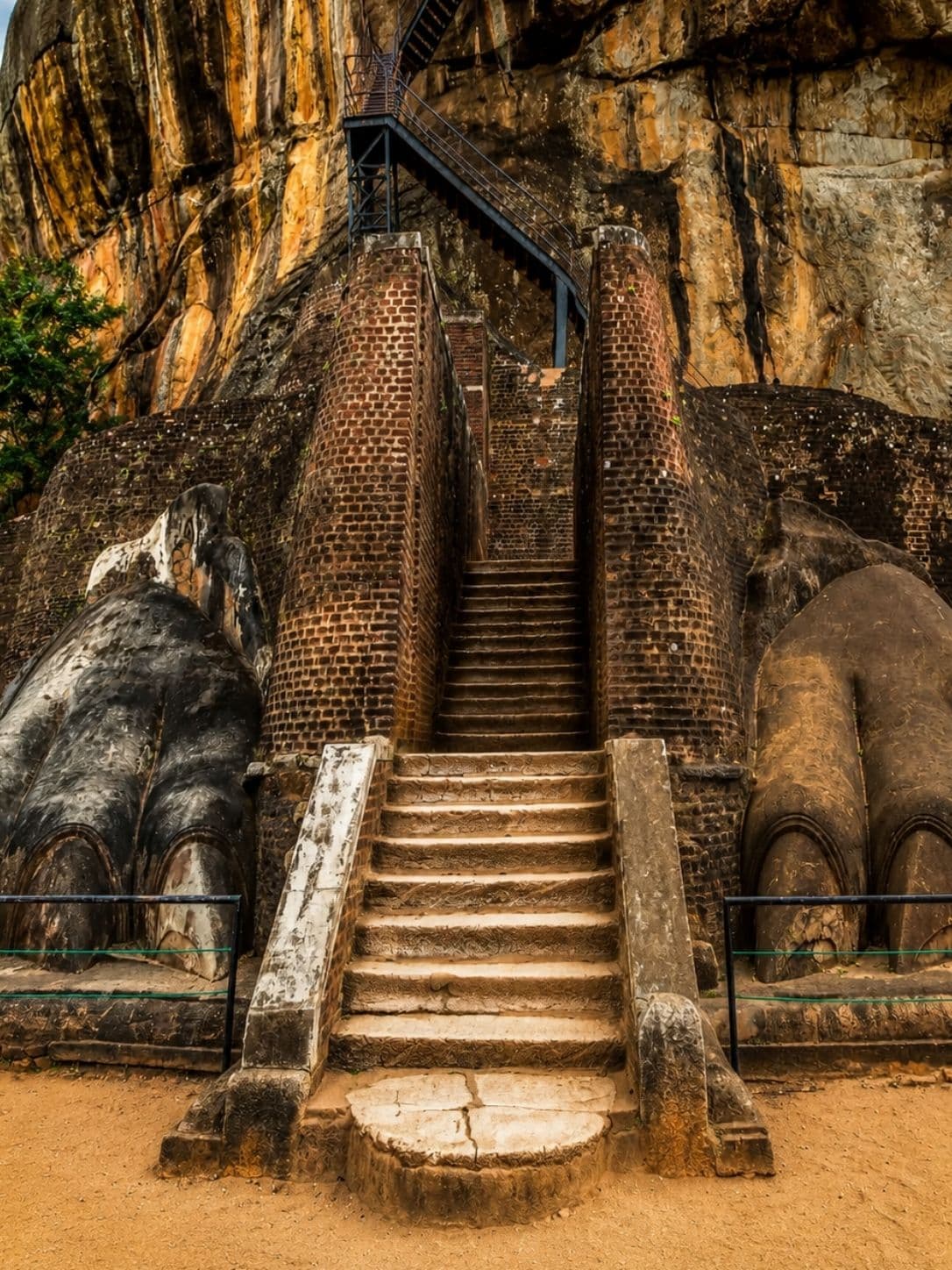 The brick lion paws at the base of the summit staircase