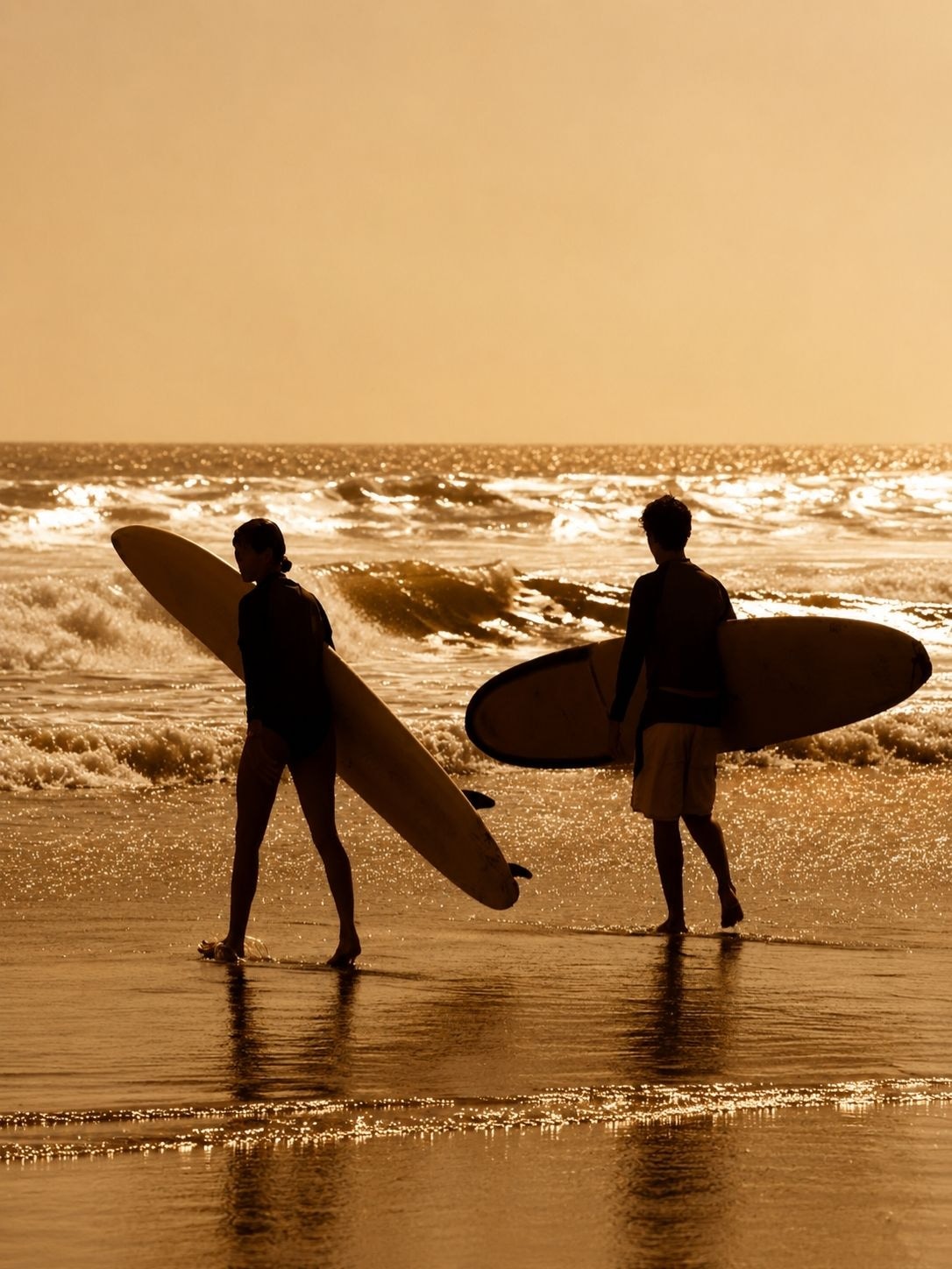 A surfer on the long right-hand point break at Arugam Bay in morning light